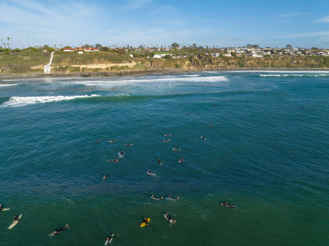 A view of Surfers off the Encinitas Coastline at Swamis in San Diego California