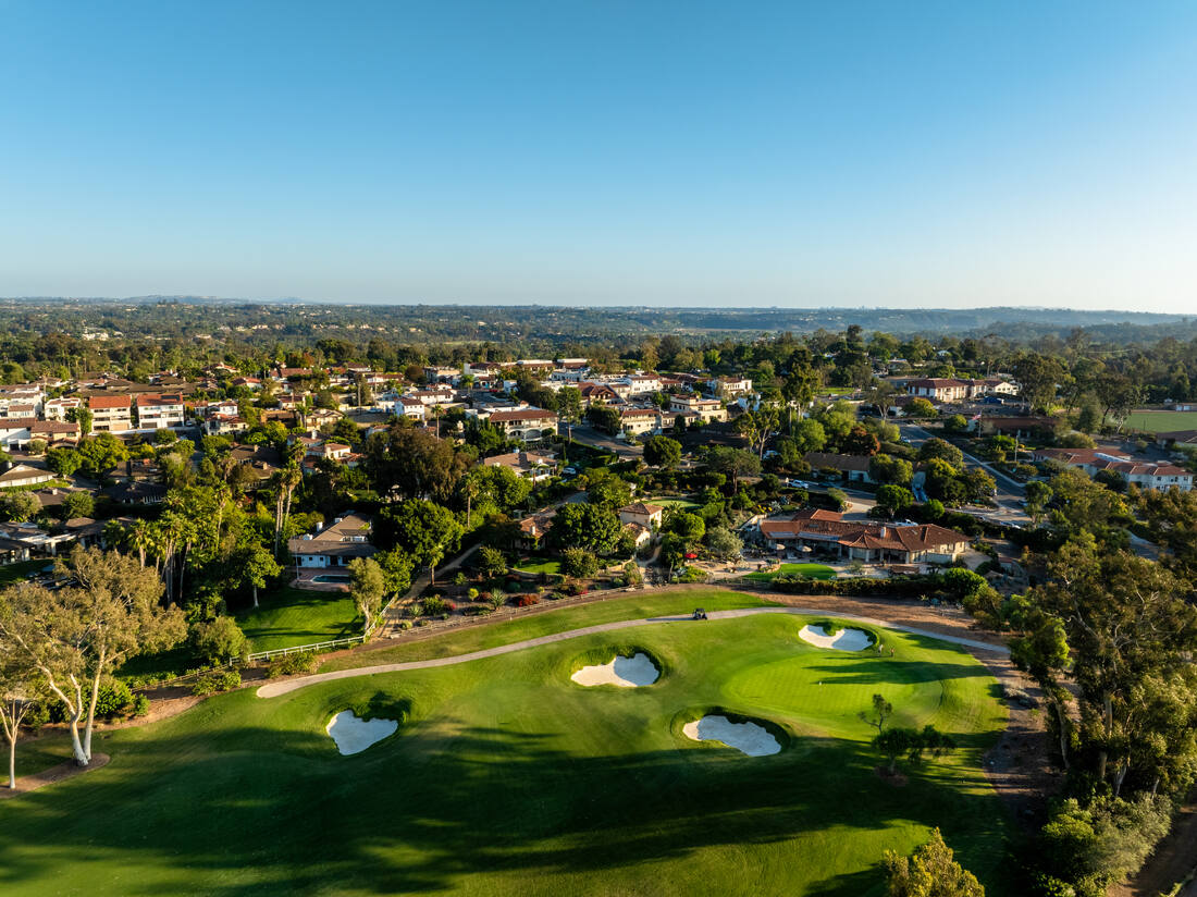 Aerial Drone Shot of Rancho Santa Fe Golf Club Golf Course in the Covenant Featuring Lush Fairways Scenic Water Features and Panoramic Landscape Views