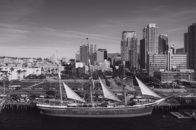 Low aerial view of the harbor, the skyline and boats at Waterfront, with boats out.