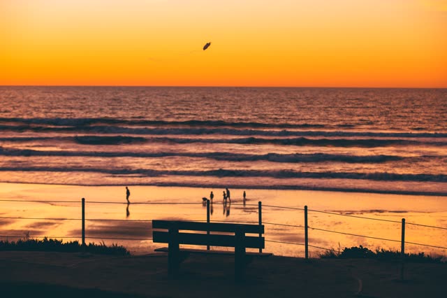 Powerhouse Park and Beach during a bright orange sunset | Photo – 6