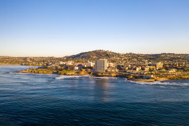 Aerial view of the cliffs, the ocean and homes at La Jolla Cove.