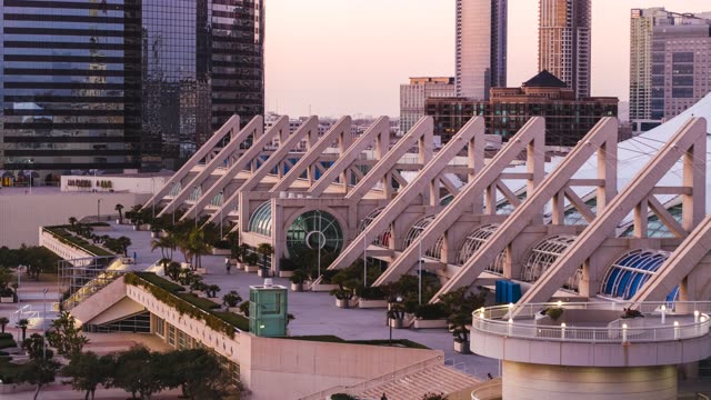 Low aerial view of the downtown streets, the skyline and palm trees at Embarcadero.