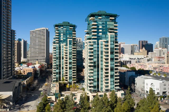 Low aerial view of the downtown streets, the skyline and the buildings at San Diego Marina.