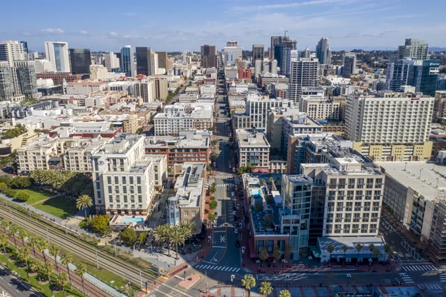 Aerial view of the downtown streets, the skyline and palm trees in Downtown San Diego.