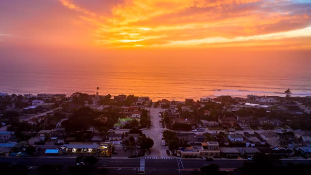 Aerial view of a residential street, the surf and the ocean in Solana Beach.