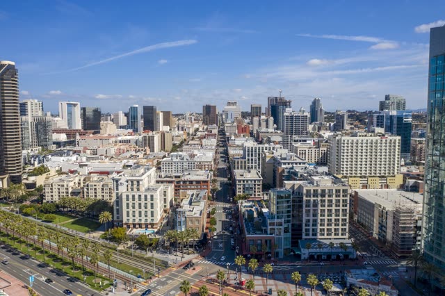 Aerial view of the downtown streets, the skyline and palm trees in Downtown San Diego.