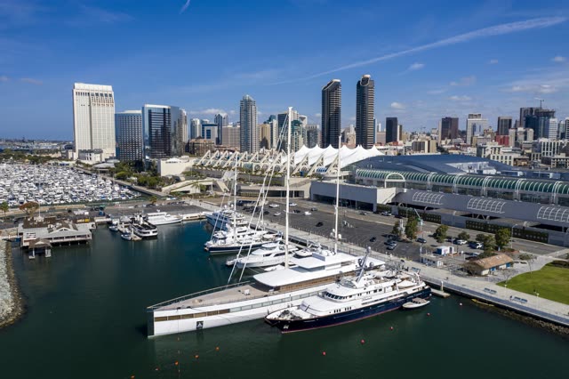 Aerial view of the harbor, the skyline and boats in Downtown San Diego, with boats out.