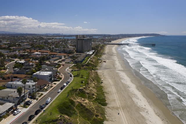 Aerial view of the beach, the surf and the pier in Pacific Beach.