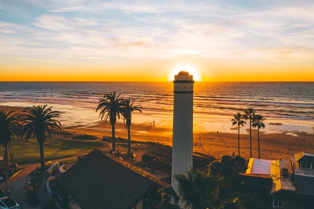 Powerhouse Park and Beach during a bright orange sunset | Photo