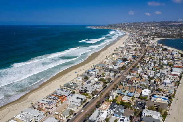 Aerial view of the beach, the surf and the ocean in Mission Bay.