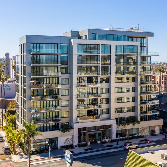 Low aerial view of the downtown streets, palm trees and the buildings at Bankers Hill.