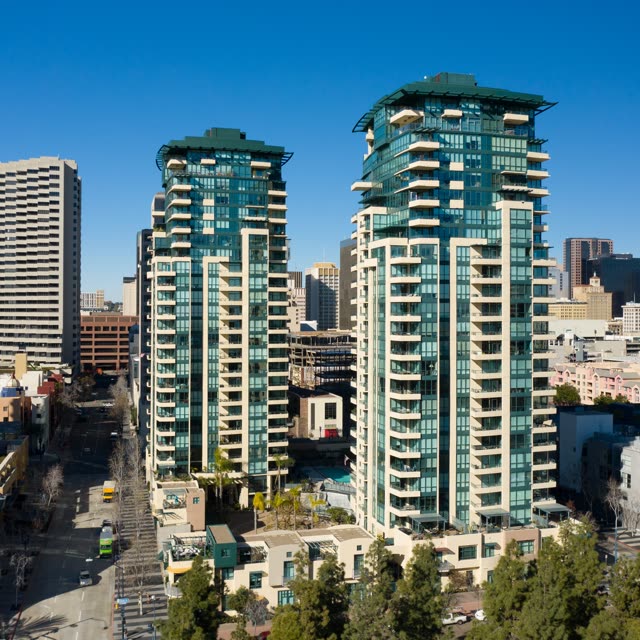 Low aerial view of the downtown streets, the skyline and the buildings at San Diego Marina.
