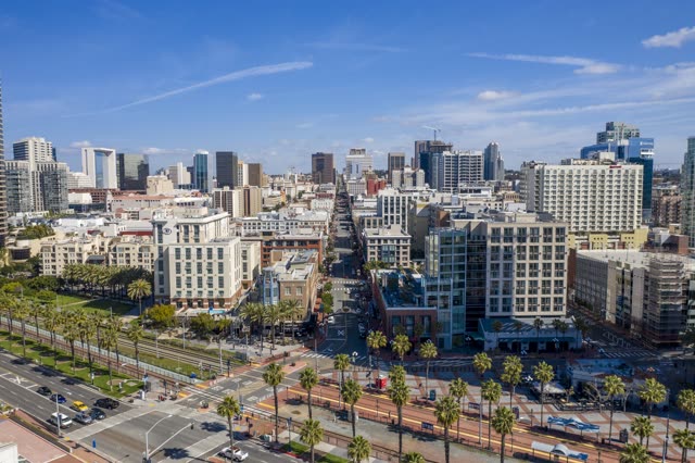 Aerial view of the downtown streets, the skyline and palm trees in Downtown San Diego.