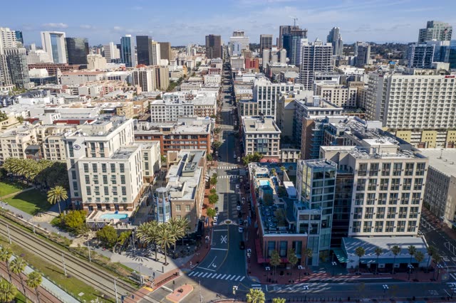 Aerial view of the downtown streets, the skyline and palm trees in Downtown San Diego.