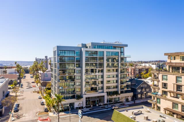 Low aerial view of the downtown streets, palm trees and homes at Bankers Hill.