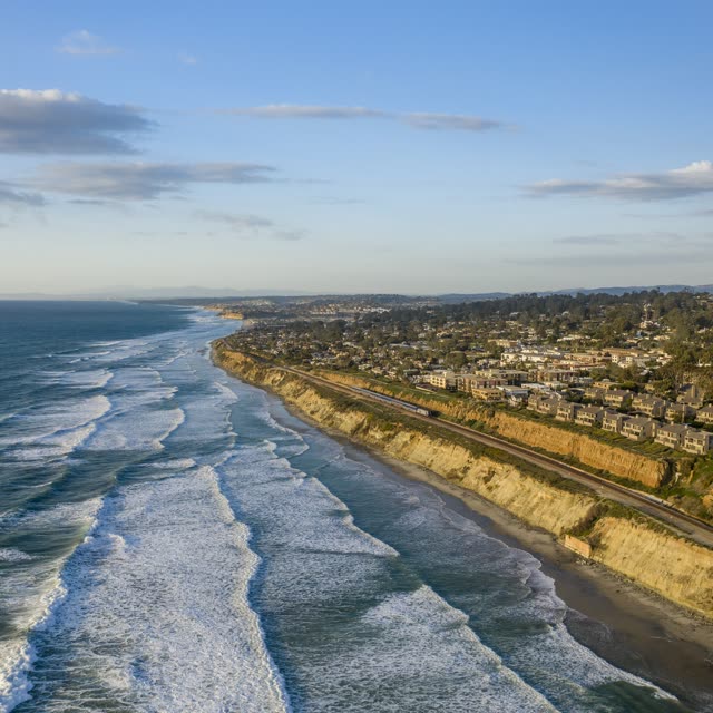 Aerial view of the cliffs, the surf and the ocean in Del Mar.