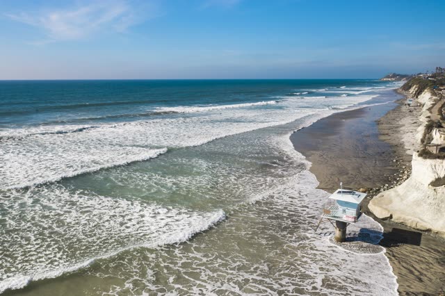 Aerial view of the beach, the surf and the ocean in Cardiff.