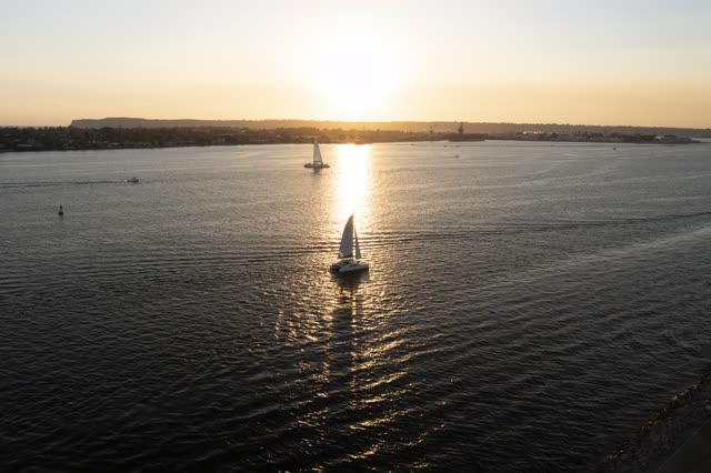 Aerial view of the harbor, boats and the bay at San Diego Marina, with boats out.