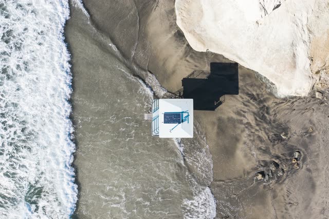 Aerial view of the beach, the surf and the ocean in Cardiff.