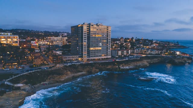 Aerial view of the cliffs, the ocean and homes at La Jolla Cove.