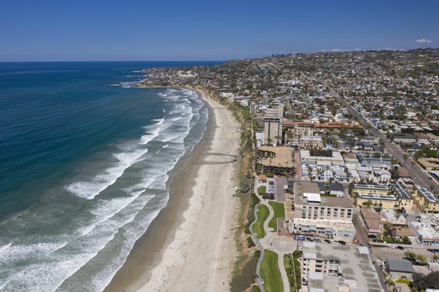 Aerial view of the beach, the surf and the ocean in Pacific Beach.