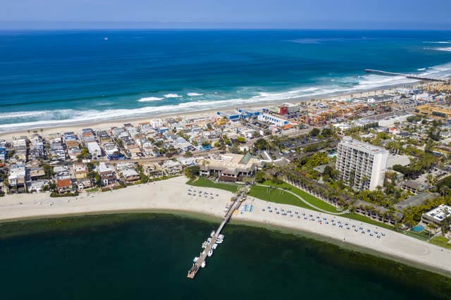 Aerial view of the beach, the surf and the pier in Mission Bay.