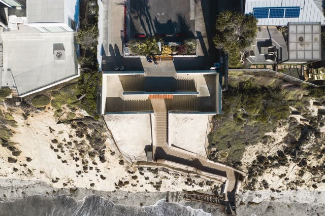 Aerial view of a residential street, the ocean and homes in Encinitas.