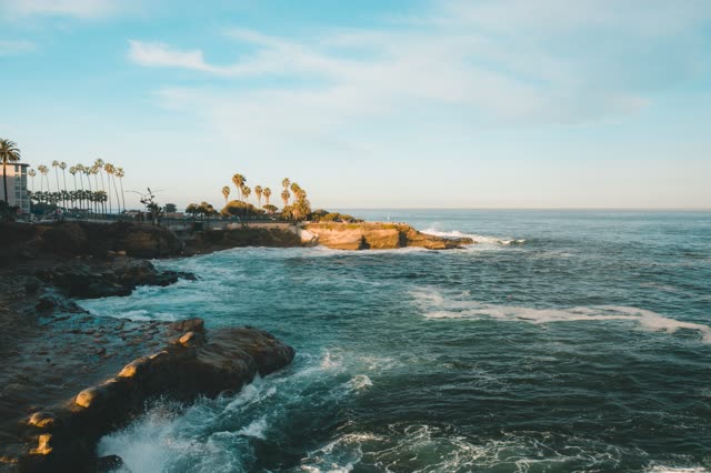 Sunrise over the waves at La Jolla Cove | Drone Photo