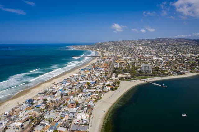Aerial view of the beach, the surf and the pier in Mission Bay.