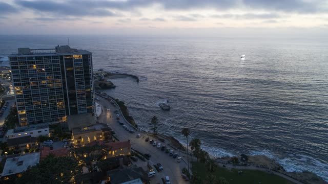 Aerial view of the cliffs, boats and the ocean at La Jolla Cove.