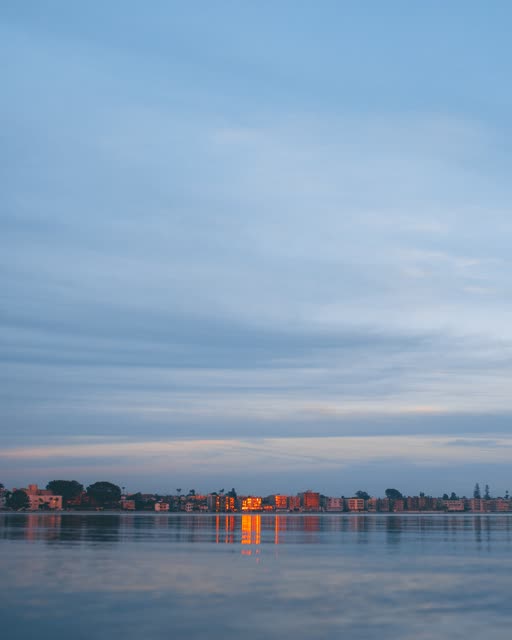View from the water of the beach, the bay and homes in Mission Bay.