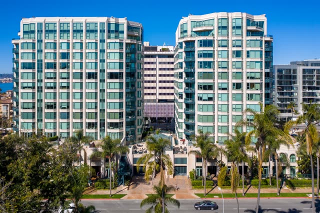 Low aerial view of the downtown streets, palm trees and the buildings at Bankers Hill.