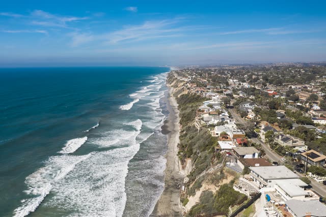 Aerial view of the cliffs, the surf and the ocean in Encinitas.