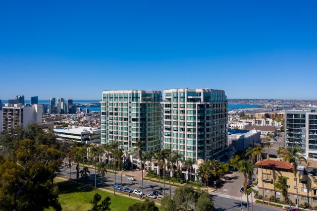 Aerial view of a residential street, the skyline and palm trees at Bankers Hill.