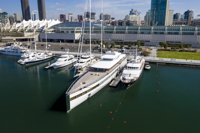 Aerial view of the harbor, the skyline and boats in Downtown San Diego, with boats out.