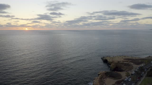 Aerial view of the cliffs, the ocean and traffic at Sunset Cliffs.