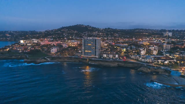 Aerial view of the cliffs, the ocean and homes at La Jolla Cove.