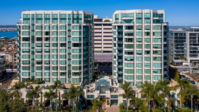 Low aerial view of the downtown streets, palm trees and the bay at Bankers Hill.