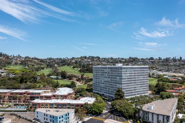 Aerial view of a residential street, homes and the buildings at La Jolla Country Club.