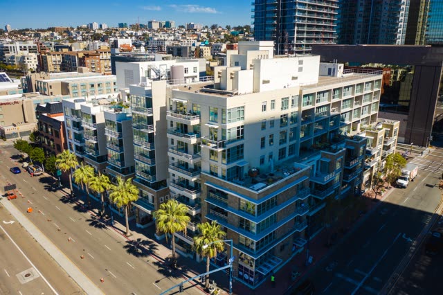 Aerial view of the downtown streets, the skyline and palm trees at Waterfront.