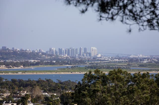 Elevated view of the country inland, the bridge and the skyline in Pacific Beach.