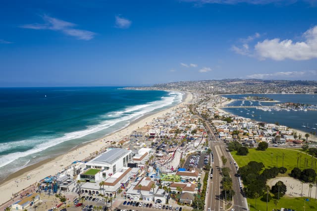 Aerial view of the beach, the surf and the pier in Mission Bay.