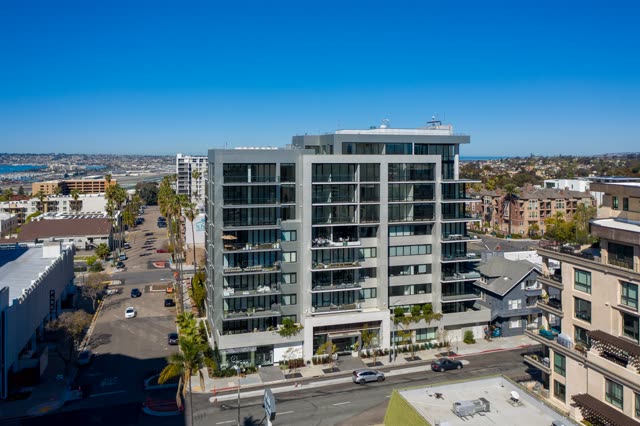 Low aerial view of the downtown streets, palm trees and homes at Bankers Hill.