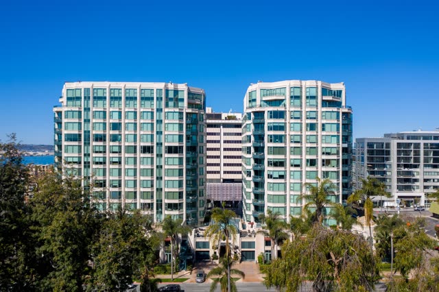 Low aerial view of the downtown streets, palm trees and the bay at Bankers Hill.
