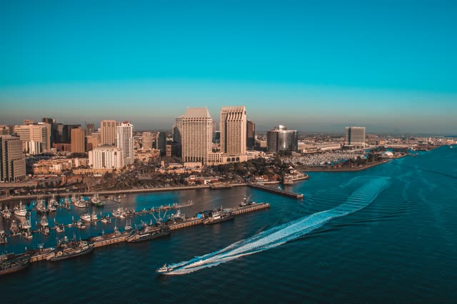 Aerial view of the harbor, the skyline and boats at San Diego Marina, with boats out.