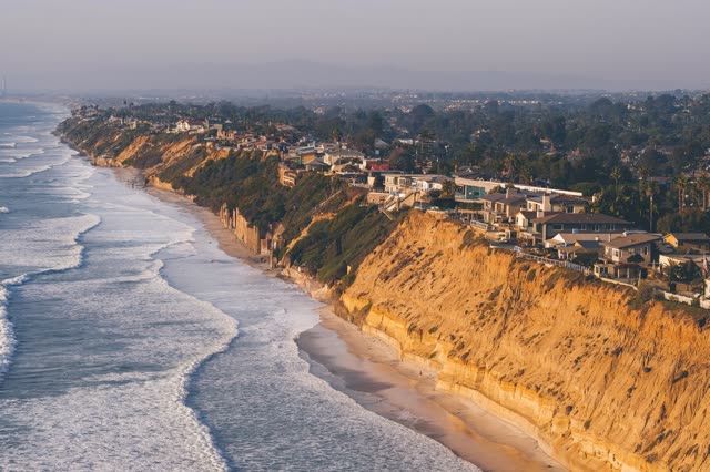 Aerial view of the cliffs, the surf and the ocean in Encinitas.