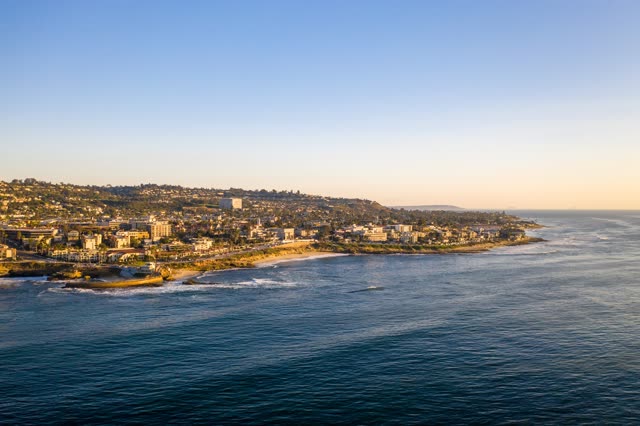Aerial view of the cliffs, the ocean and homes at La Jolla Cove.