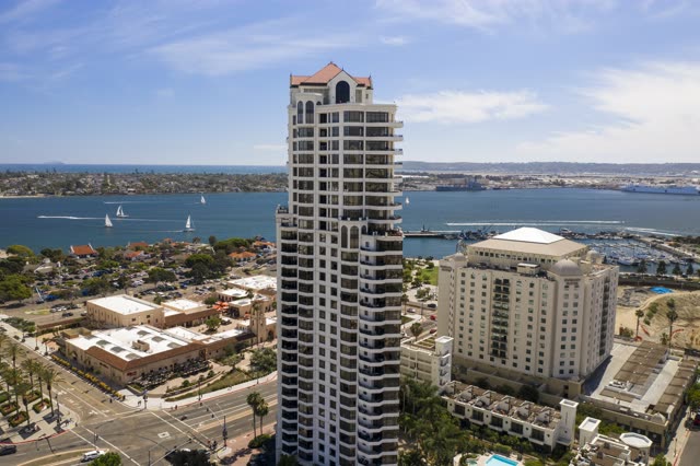Aerial view of the downtown streets, boats and the bay at San Diego Marina, with boats out.