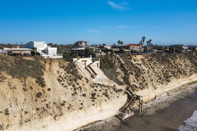 Aerial view of the cliffs, palm trees and the ocean in Encinitas.
