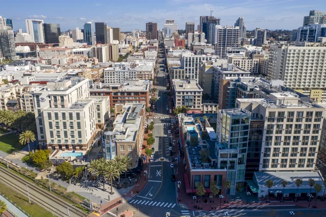 Aerial view of the downtown streets, the skyline and palm trees in Downtown San Diego.